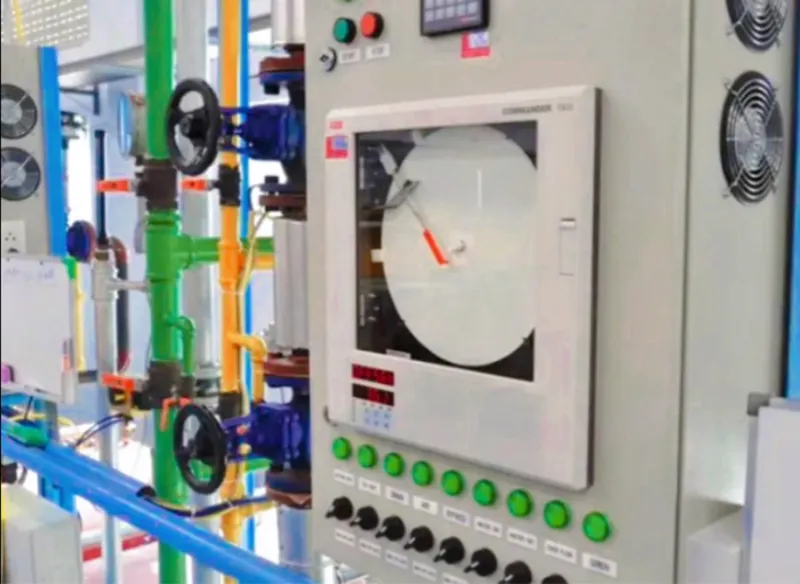 Machine control panel and piping on the production line
