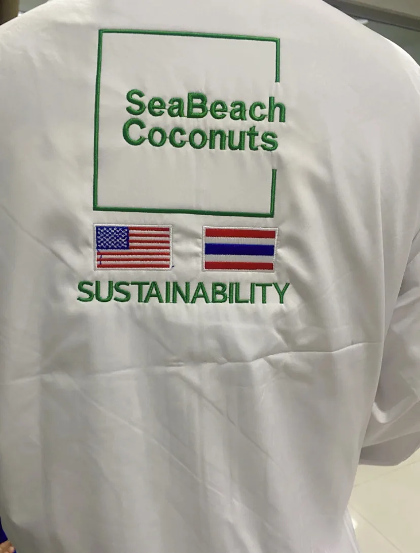 Back of a uniform embroidered with the SeaBeach Coconuts logo and the word Sustainability